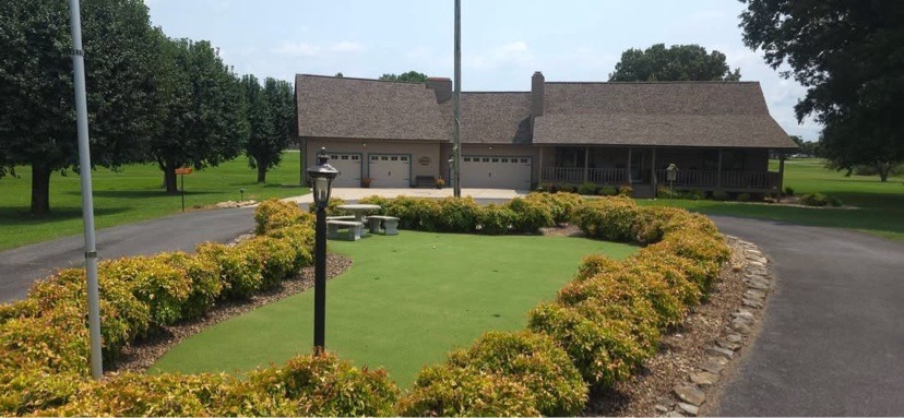 Finished backyard putting green installed by S & J Synthetic Turf